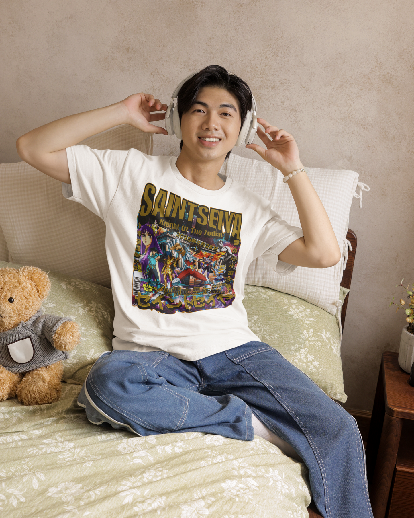 “Asian model wearing white Knight of the Zodiac anime-inspired t-shirt with bold vintage graphic.”