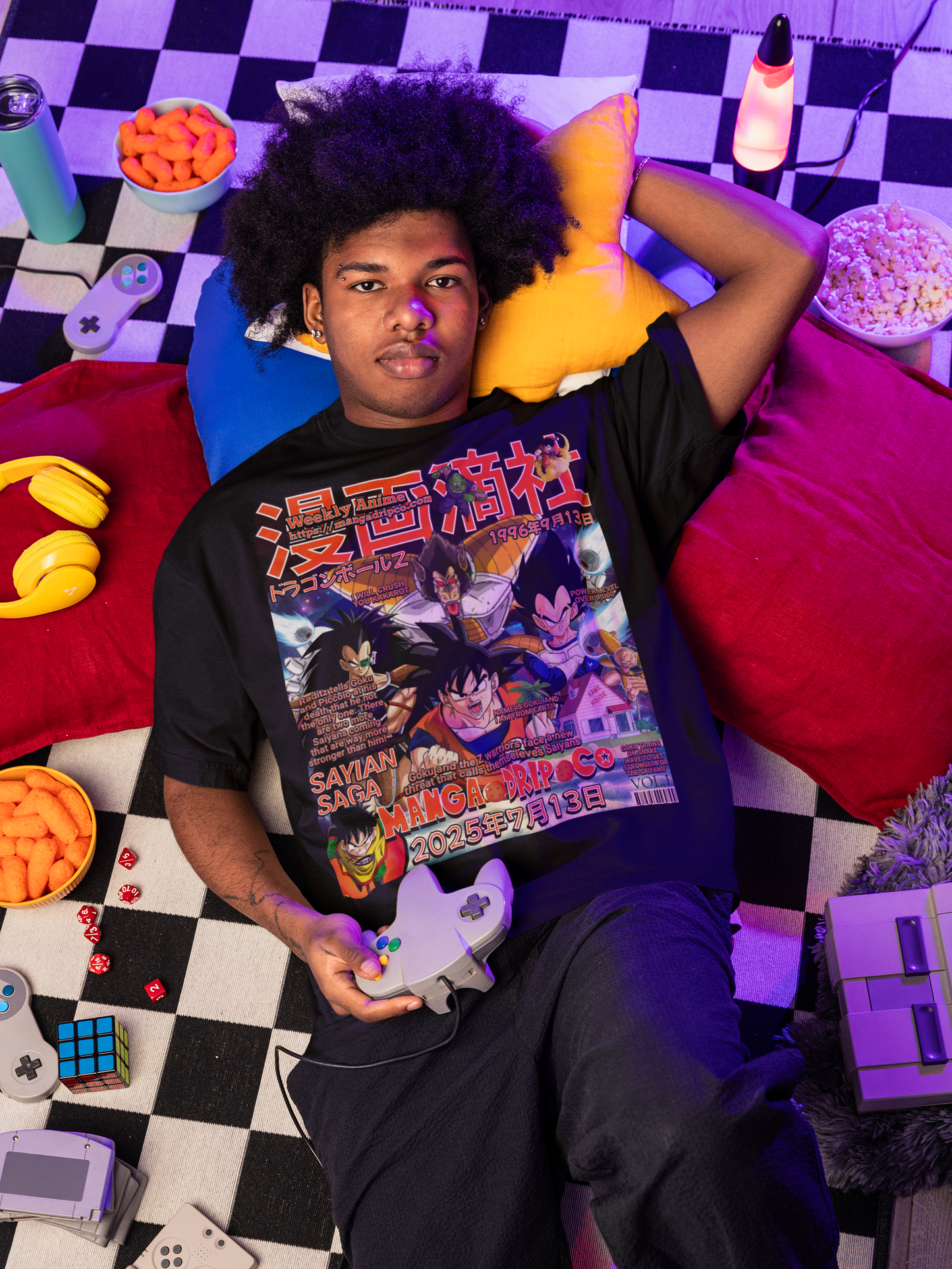 Black boy model lying down on the floor wearing black Goku vs Vegeta Dragon Ball Z Saiyan Saga graphic tee – urban Otaku streetwear style.